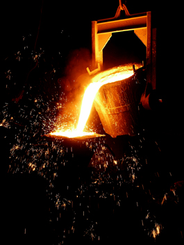 Pouring molten metal while casting iron