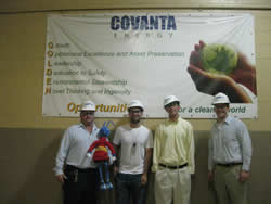 Energy Ant and friends in front of sign at Coventa Waste-to-Energy Plant.