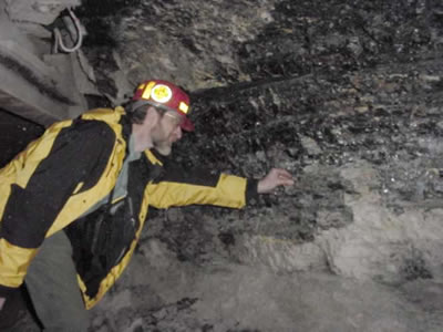 Professor Darmody of the University of Illinois explores a coal mine.