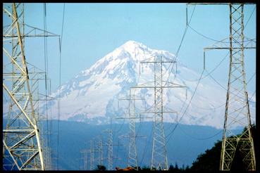 Picture of power lines with mountains in background.