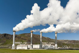 A geothermal power plant emitting steam.