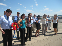 Picture of Energy Ant with and Department of Energy interns on top of DOE headquarters.