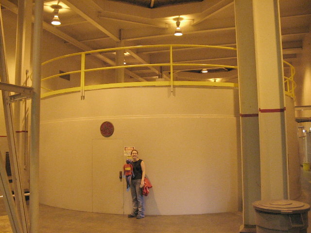 Energy ant and friend in front of electicity generator.